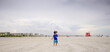 © Tamara Sales  - Boy playing on the beach at siesta Key florida with the snd and birds