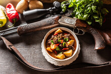 Deer Stew In A Bowl Hunting Weapon As A Decoration