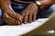 © Arindam - signing on an important paper. marriage registration witness hands