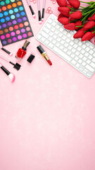 Wall Mural - Beauty makeup shopping feminine pink red theme bloggers desktop workspace with keyboard and accessories on stylish pink textured background. Top view blog hero header creative composition flat lay.