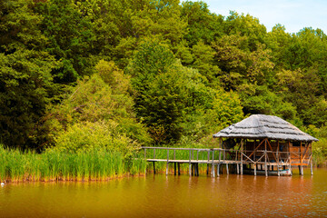 Canvas Print - cottage on the pontoon of the lake on a beautiful summer day
