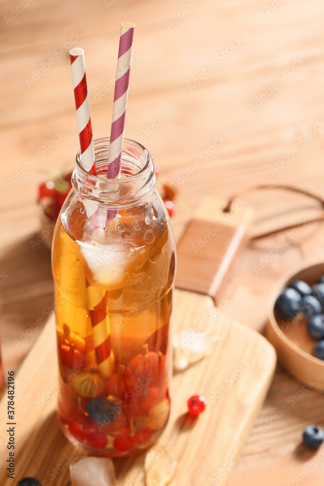 Bottle of fresh ice tea on table