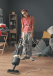 © StockPhotoPro - Frustrated housewife doing household chores at home