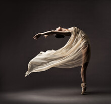 Ballerina Dancing With Silk Fabric, Modern Ballet Dancer In Fluttering Waving Cloth, Pointe Shoes, Gray Background