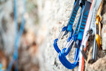 Wall Mural - A few carabiners for climbers on a rock