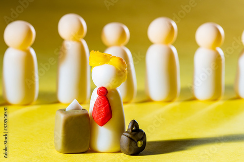 White men yellow background. Men symbolize US Republican Party. Figures from plasticine. Republican presidential candidate in foreground. US President and ballot box. Democrats Rivals during voting.