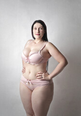 portrait of beautiful curvy girl in lingerie