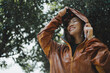 © PBXStudio - Asian woman is outdoors while it's raining. She felt refreshed.