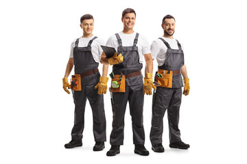 Sticker - Full length portrait of a team of service workers with tool belts