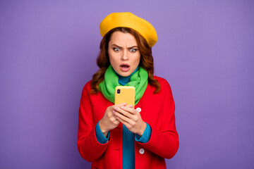 Close-up portrait of her she nice-looking attractive lovely outraged dissatisfied wavy-haired girl using digital cell browsing fake news isolated over violet lilac purple pastel color background