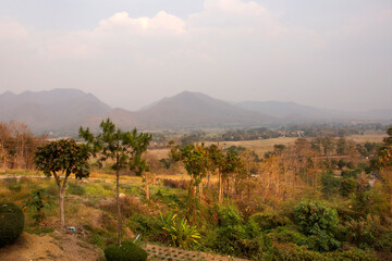 View landscape and cityscape of Pai city with sunrise in morning time while PM 2.5 Dust situation at Pai city hill valley in Mae Hong Son, Thailand