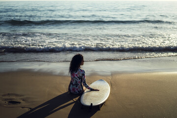 Sticker - Beautiful shot of a European female posing with her surfboard