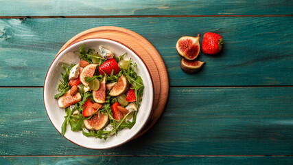 Poster - vegetarian salad with rucola, figs, blue cheese, strawberries, grapes, Long banner format. space for text