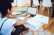 © BullRun - Female typing text on laptop