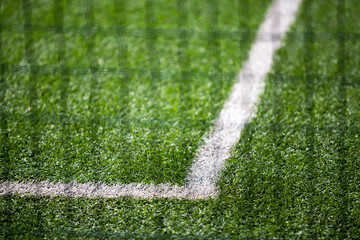 Photo of the details of football field with artificial grass