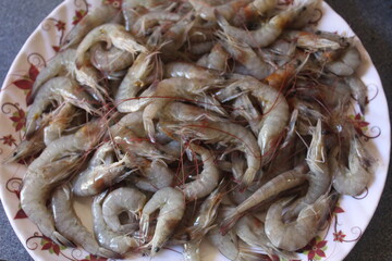 Raw shrimp on the plate ready for sale shrimp on the plate for delicious food preparation