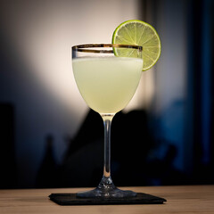 Ccoktail Lime and Gin gold rim glass nick & nora with back light 