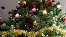 Camera Panning Through Christmas Tree Showing Decorations And Ornaments And Revealing A Beautiful Golden Star Tree At The Top
