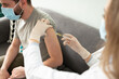 © AntonioDiaz - Man receiving a vaccine on his arm