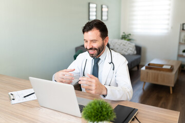 Video call with a Hispanic doctor working from home