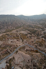 Wall Mural - Natural landscape view from hot air balloon ride and tour in Kapadokya Goreme valley, semi-arid region known for its distinctive fairy chimneys, tall, cone-shaped rock formation- Cappadocia, Turkey