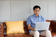 © offsuperphoto - asian senior man using computer laptop at home