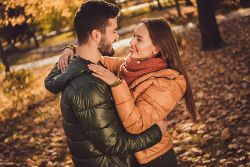 Poster - Photo of passionate affectionate couple girl hug soulmate boyfriend in fall forest september park wear jackets coats