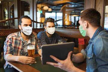 Poster - people and pandemic concept - male friends with tablet pc computer drinking beer at bar or pub