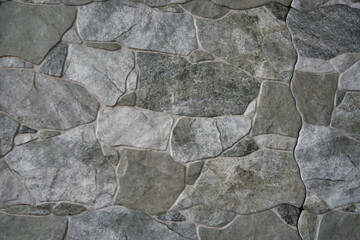 Wall Mural - Closeup shot of a texture of a stone wall - perfect for background or wallpaper