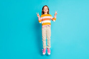 Poster - Full length body size view of her she nice attractive pretty lovely cute cheery girl jumping having fun showing double v-sign isolated over bright vivid shine vibrant blue color background