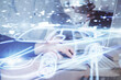 © peshkova - Automobile theme drawing with businessman working on computer on background. Autopilot taxi concept. Double exposure.