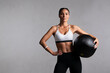 Determined fitness woman on grey background