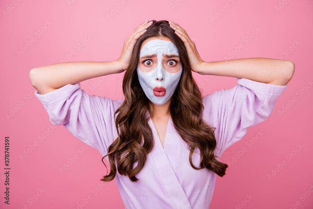 Photo portrait of amazed surprised upset girl with cosmetic mask on face keeping hands on head shocked isolated on pink color background - obrazy, fototapety, plakaty 