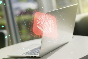 Multi exposure of creative fingerprint hologram on laptop background, personal biometric data concept