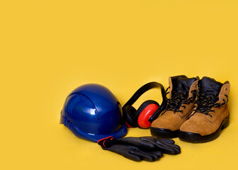 Construction Personal protective equipment on yellow background