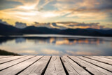 Fototapeta Na sufit - Showcase an old wooden table shelf on a beautiful sunset and blurred nature background.	