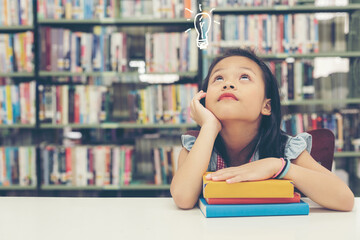 Asian beautiful girl thinking idea and reading books for education and go to school in library. Education and Lifestyle Concept