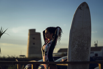 Sticker - Female and her surfboard by the ocean