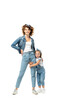 © LIGHTFIELD STUDIOS - daughter in denim outfit hugging mother leg isolated on white