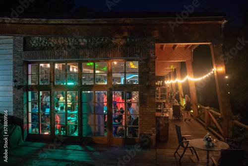 Fotomural View of restaurants from outside at night. Wedding party
