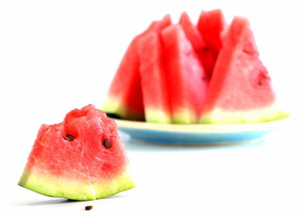 Pieces of juicy ripe sweet natural watermelon on white. Useful vitamins in summer. Seasonal fruits and berries.