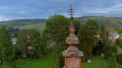 Wall Mural - Aerial view of old wooden church in Pylypets, Carpathian village, Ukraine