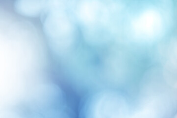 light blue leaf background. blurred leaves and circular bokeh. abstract for design and wallpaper.