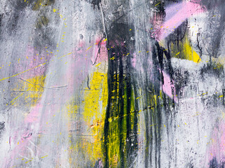 Rough paint dripping, spray paint artwork. Abstract background oil paint painting style. Damage to walls with many colors. Rough concrete surface with cracks, scratches and paint stains