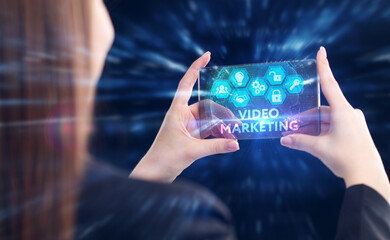 Business, Technology, Internet and network concept. Young businessman working on a virtual screen of the future and sees the inscription: Video marketing