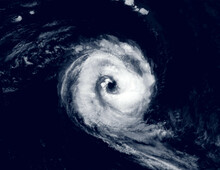 Hurricane Eye Over Sea, View Of Tropical Storm Or Cyclone From Space. Ocean Typhoon On Satellite Photo Of Earth. Elements Of This Image Furnished By NASA.