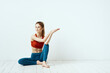 © SHOTPRIME STUDIO - Sportive woman pose gymnastics balance exercise light background