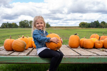 Little Girl Holding Pumpkin Free Stock Photo - Public Domain Pictures