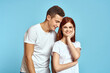 © SHOTPRIME STUDIO - Young woman and man stinks relationship on blue background cropped view of couple in love