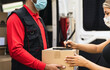 © Alessandro Biascioli - Delivery man wearing face protective mask to avoid corona virus spread - Young express courier delivering to costumer during coronavirus outbreak - Deliver and online buying concept
